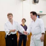 Teacher demonstrating that we want to lead with a light touch and clear direction