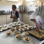 Mai producing a spicy Vietnamese noodle salad with spring rolls for Saturday lunch.