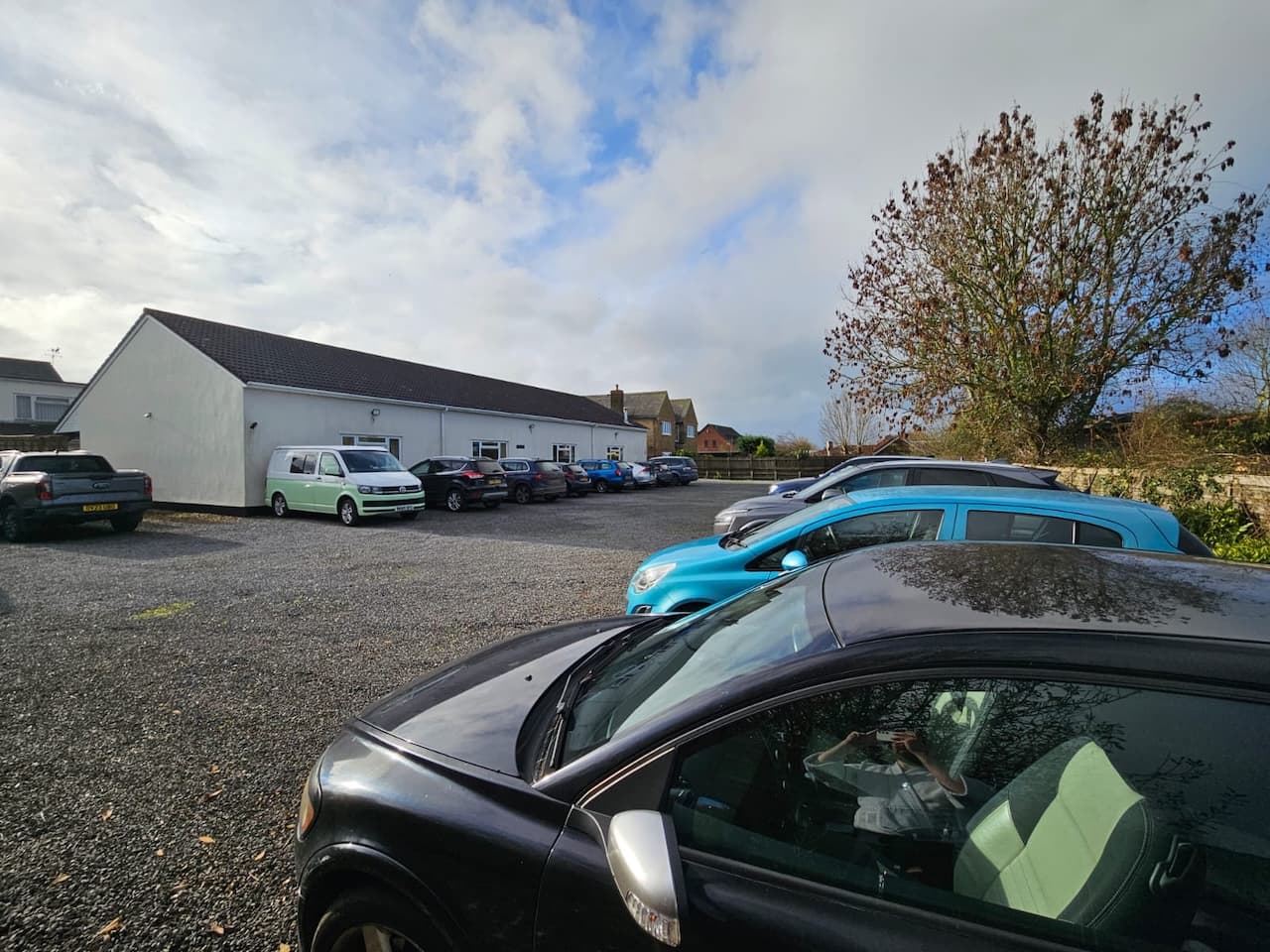 The car park filling up before the course